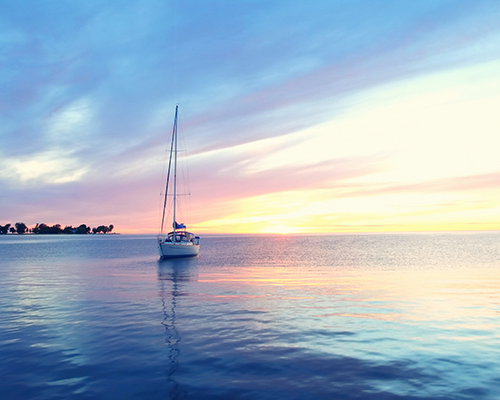 WI Sunset over lake with sailboat